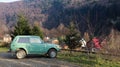 Ukraine, Yaremche - November 20, 2019. A jeep is parked with a mountain range in the background. The car is in the mountains of