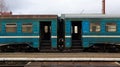 Ukraine, Yaremche - November 20, 2019: train at the station on a background of mountains. Unique railway cars on the platform in