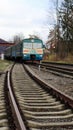 Ukraine, Yaremche - November 20, 2019: train at the station on a background of mountains. Unique railway cars on the platform in