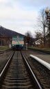 Ukraine, Yaremche - November 20, 2019: train at the station on a background of mountains. Unique railway cars on the platform in