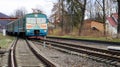 Ukraine, Yaremche - November 20, 2019: train at the station on a background of mountains. Unique railway cars on the platform in