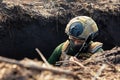Ukrainian Armed Forces soldier with a rifle in a trench Royalty Free Stock Photo