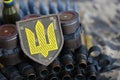 Ukrainian army symbol on machine gun belt lies on ukrainian pixeled military camouflage