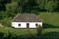 Ukrainian authentic house. Old authentic wooden typical house. The architecture of traditional Ukrainian village. House with woode