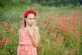 Ukrainian Beautiful girl in field of poppies and wheat. outdoor portrait in poppies Royalty Free Stock Photo