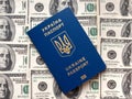 Ukrainian biometric passport on US dollars background Royalty Free Stock Photo