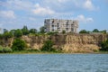 Ukrainian block of flats on the Danube river shore seen from romanian side - Danube river Ukraina - steep ground wall - Ucraina Royalty Free Stock Photo