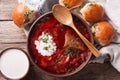 Ukrainian borsch soup and garlic buns close-up. Horizontal top v Royalty Free Stock Photo