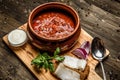 Ukrainian borsch soup and garlic buns on the table. Royalty Free Stock Photo