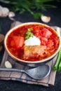 Ukrainian borscht with white beans on the bowl. Plate of red beet root soup borsch on black rustic table. Beetroot soup Royalty Free Stock Photo