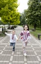 Ukrainian children in national embroidered clothes, joyfully holding hands, run forward to victory