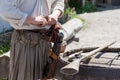 Loading a powder to the barrel of an antique shotgun