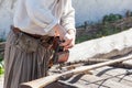 Loading a powder to the barrel of an antique shotgun