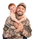 Ukrainian defender in military uniform with his little son on white background Royalty Free Stock Photo