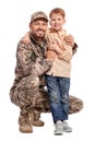 Ukrainian defender in military uniform with his little son on white background Royalty Free Stock Photo