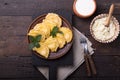 Ukrainian dumplings, pierogi or pyrohy, varenyky, vareniki, served with cottage cheese on board. National Russian cuisine, natural