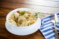 Ukrainian dumplings stuffed with potatoes and mushrooms, served with fried onions.