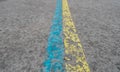 Ukrainian flag colors on asphalt, yellow, blue freedom, world peace