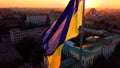 Ukrainian Flag flutters in the wind. Beautiful sunset