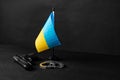 Ukrainian flag and handcuffs on black background, concept of crime and justice in the country Royalty Free Stock Photo