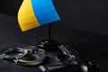 Ukrainian flag and handcuffs on black background, concept of crime and justice in the country Royalty Free Stock Photo