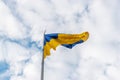 Ukrainian flag waving in the wind against the sky Royalty Free Stock Photo