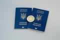 Ukrainian foreign passports and bitcoin coin. Ukraine and cryptocurrency concept. on white background