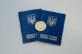 Ukrainian foreign passports and bitcoin coin. Ukraine and cryptocurrency concept. on white background