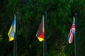 Ukrainian, German flags and the Union Jack are waving in the wind on flagpoles. Political situation between Ukraine, United Royalty Free Stock Photo