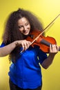 violinist afro ukrainian girl enjoying with her violin during the concert