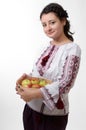 Ukrainian girl holding a bolter with apples