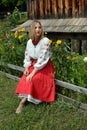 Ukrainian girl in national clothes against the background of old