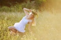 Ukrainian girl in a white sundress with a wreath of flowers on h Royalty Free Stock Photo