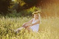 Ukrainian girl in a white sundress with a wreath of flowers on h Royalty Free Stock Photo