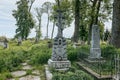 Ukrainian gravestone on old abandoned Polish city cemetery in Zhydachiv, Lviv region, Ukraine. Weathered stone tombstone Royalty Free Stock Photo