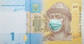 Ukrainian 1 gryvnia banknote with face mask