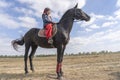 Ukrainian guy on horseback participate in the Ethno-eco festival Kolodar in city Slavuta, Ukraine Royalty Free Stock Photo