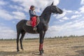 Ukrainian guy on horseback participate in the Ethno-eco festival Kolodar in city Slavuta, Ukraine Royalty Free Stock Photo