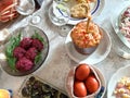 Ukrainian holiday table. Easter lunch. Colored eggs. Appetizing and satisfying foods. modern