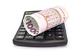 Ukrainian hryvnia, 1000 hryvnia banknote and calculator on white. Banknotes are rolled up Royalty Free Stock Photo