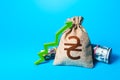 Ukrainian hryvnia money bag and red up arrow. Economic growth, GDP. Increase in the deposit rate. Rise in profits, budget fees. Royalty Free Stock Photo