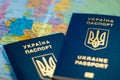 Ukrainian international biometric passport on a map background.