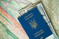 Ukrainian passport and American dollars are on the map Royalty Free Stock Photo