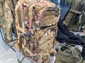Ukrainian military camouflage backpack displayed on a mannequin stand in dimly lit store environment, featuring multiple Royalty Free Stock Photo