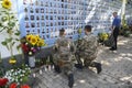 Ukrainian military near Memory Wall of Fallen Defenders of Ukraine in war in Eastern Ukraine 2014-2020. Kyiv, Ukraine