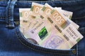 Ukrainian money. New banknotes five hundred hryvnia bills UAH in the back pocket of blue jeans. Money concept Royalty Free Stock Photo