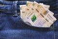 Ukrainian money. New banknotes five hundred hryvnia bills UAH in the back pocket of blue jeans. Money concept Royalty Free Stock Photo