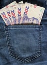 Ukrainian money. New banknotes 200 two hundred hryvnia bills UAH in the back pocket of blue jeans. Money concept, Corruption Royalty Free Stock Photo