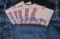 Ukrainian money. New banknotes 200 two hundred hryvnia bills UAH in the back pocket of blue jeans. Money concept, Corruption Royalty Free Stock Photo