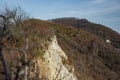 Ukrainian mountains. Lonely house in the forest and clay rock